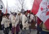 Canada’s Relationship With First Nations Is a Failure A group of people in traditional attire marching with flags.