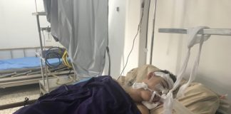 Canada Supports Christian-Slaying Sectarian terrorists in Syria A young child lying in a hospital bed with medical tubes attached.