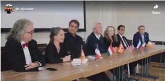 Bombshell News Delegates from multiple countries at an international conference table.