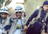 ISIS Fire Brigade Two men in outdoor gear posing for a photo, one pointing at the camera.
