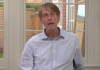 160+ experts slam COVID vaccines as ‘unnecessary, ineffective and unsafe’ in powerful letter/By Raymond Wolfe An elderly man speaking indoors near a window.