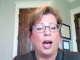 Video: Toxicologist Dr. Janci Chunn Lindsay to the CDC: Stop Vaccinations A woman with glasses speaking in front of a wooden door.