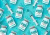 CDC: 10,991 Dead, 551,172 Injuries Following COVID-19 Injections COVID-19 vaccine vials and syringes arranged on a teal background.