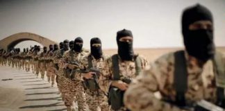 US to Hand Raqqa Over to ISIS Affiliates After “Defeating” ISIS/ By Tony Cartalucci, August 24, 2017 A line of armed soldiers in camouflage and masks standing in formation.