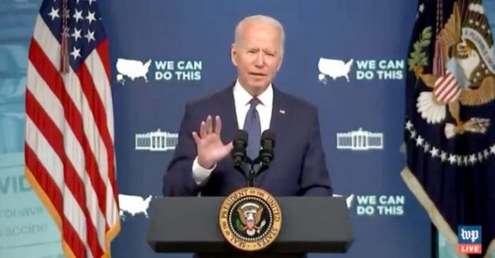 President Joe Biden speaking at a White House podium.