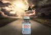 Now it has Happened: Vaccinated Pilot Dies in Flight. Emergency Landing and Uproar in the Aviation Industry A COVID-19 vaccine vial with a dramatic fighter jet in the sky.