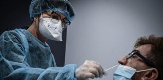 Invention of “The Covid Narrative”: The PCR Test Sustains The Myth of a Global Pandemic. It Serves to “Maintain Fear”/ By Dr. Nicole Delépine Healthcare worker performs a COVID-19 nasal swab test on a patient.