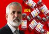 Before your Child is Injected, Watch Dr. Robert Malone’s statement on Child COVID Vaccinations Man with gray beard and COVID-19 vaccine vials labeled ADE in the background.