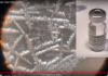 Graphene COVID Kill Shots: Let the Evidence Speak for Itself/ By Dr. Ariyana Love Microscopic crystalline structures beside a vaccine vial labeled 'COVID-19 Vaccine'.