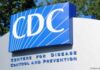 VAERS COVID Vaccine Adverse Event Reports through December 24, 2021 — 21,002 Deaths Signboard of the Centers for Disease Control and Prevention (CDC) outdoors.