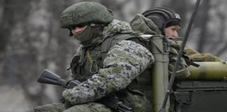 Ignored reasons for the crisis in Ukraine/By the Ambassador of Russia to Nicaragua, Mr. Alexandr Khokholikov Soldier in camouflage gear holding a weapon, ready for combat.