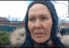 “Who are the crazy people? Some people call them nazis.” A woman wearing a knitted hat and a fur-lined coat outdoors.
