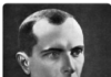 Stepan Bandera and the 1941 “Ukrainian State” • Petro Yarovyy Black and white portrait of a serious man in a suit and tie.