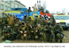 Putin lecture on how the West abetted Hitler (2019) Group of armed men in military gear posing with flags and symbols.