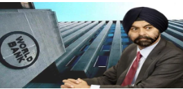 Confident businessman in a turban posing by a modern building.