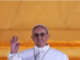 Pope Francis waving with a warm smile.