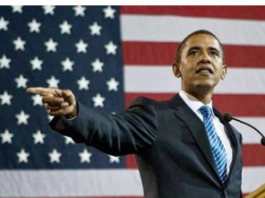 Barack Obama speaking in front of an American flag.
