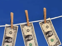Three dollar bills clipped to clothesline