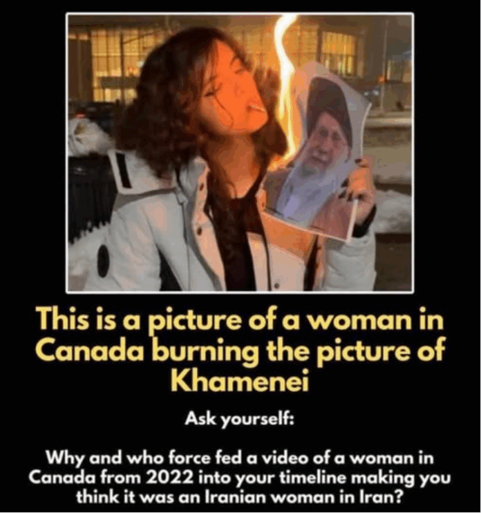 Woman burning portrait at nighttime protest