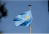 America Officially Withdraws from the World Health Organization Waving blue flag with yellow emblem