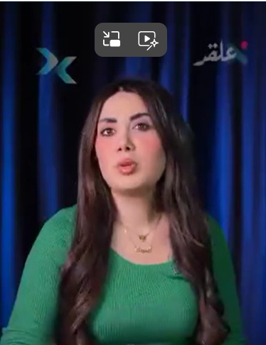 Female TV presenter in green top