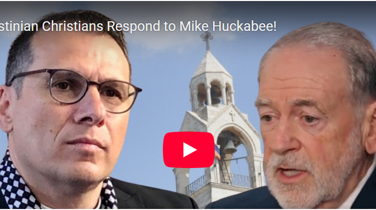 Two men before church bell tower