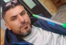 Alawites Between the Hammer of K.i.l.l.i.n.g and the Anvil of Official Silence/ By Waheed Yazbek _ Homs Bearded man in blue jacket with mop