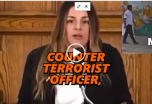 We Are The Terrorists/ Josephine Guilbeau Woman speaking at podium with orange text